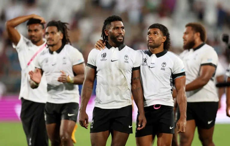 Fiji players celebrate after winning the Singapore Sevens final at Singapore National Stadium
