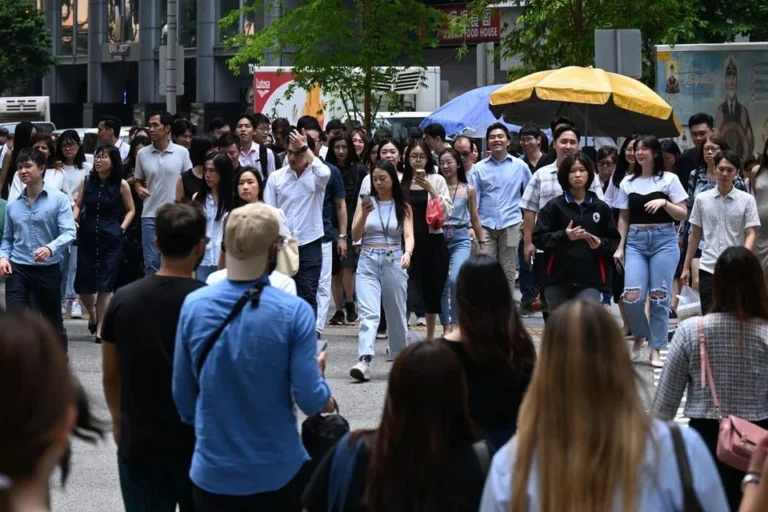 Office workers in Singapore’s CBD walking during lunch hour