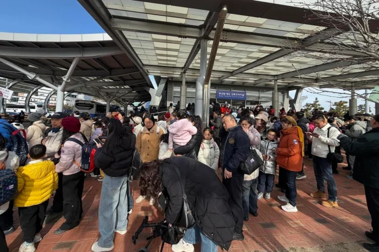 Adora Magic City cruise ship at Busan International Cruise Terminal with Chinese tourists disembarking